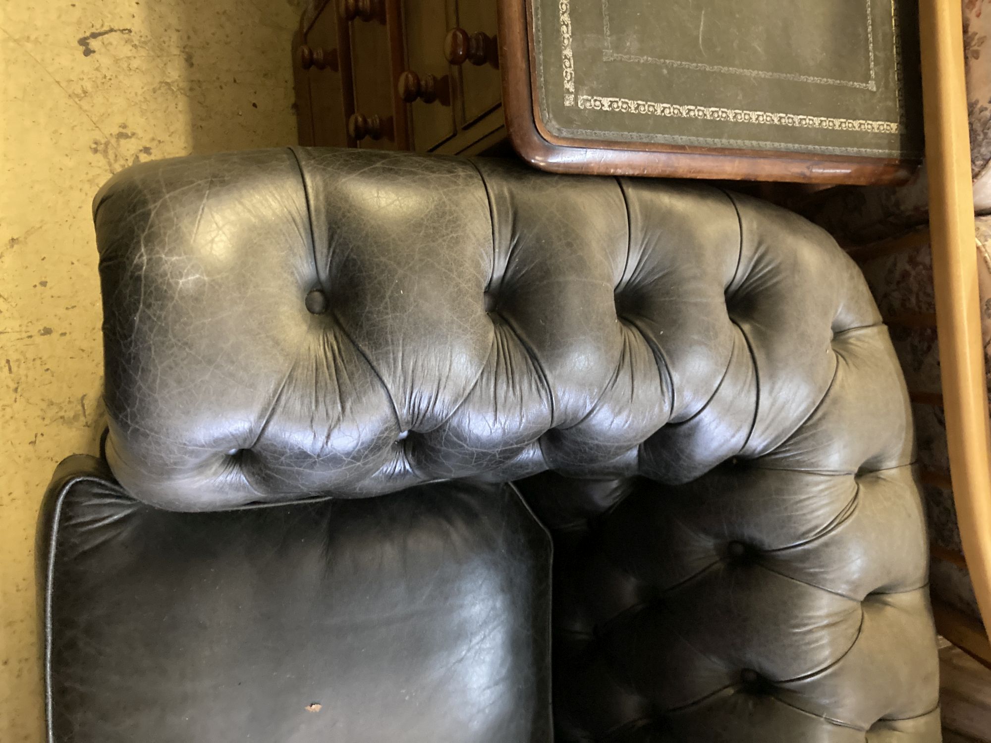 A Fleming & Howland, Chesterfields buttoned black leather three seater Chesterfield settee, length 200cm, depth 86cm, height 74cm